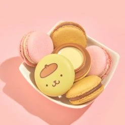 The Crème Shop X Sanrio Pompompurin Holiday Macaron Lip Balm - Caramel Pudding Collabs